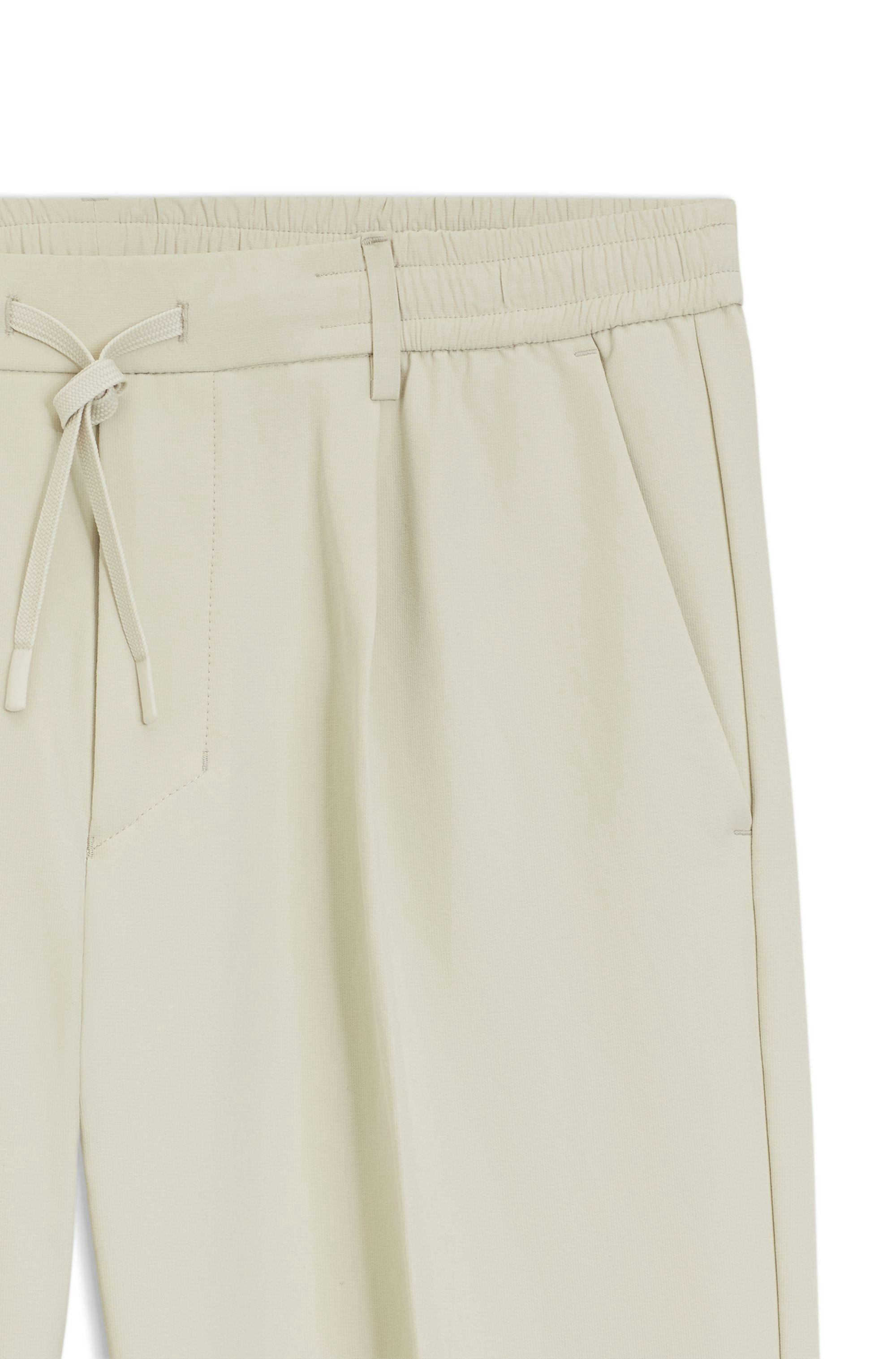 Aktivní zúžené kalhoty z voděodolné strečové tkaniny - Light Beige