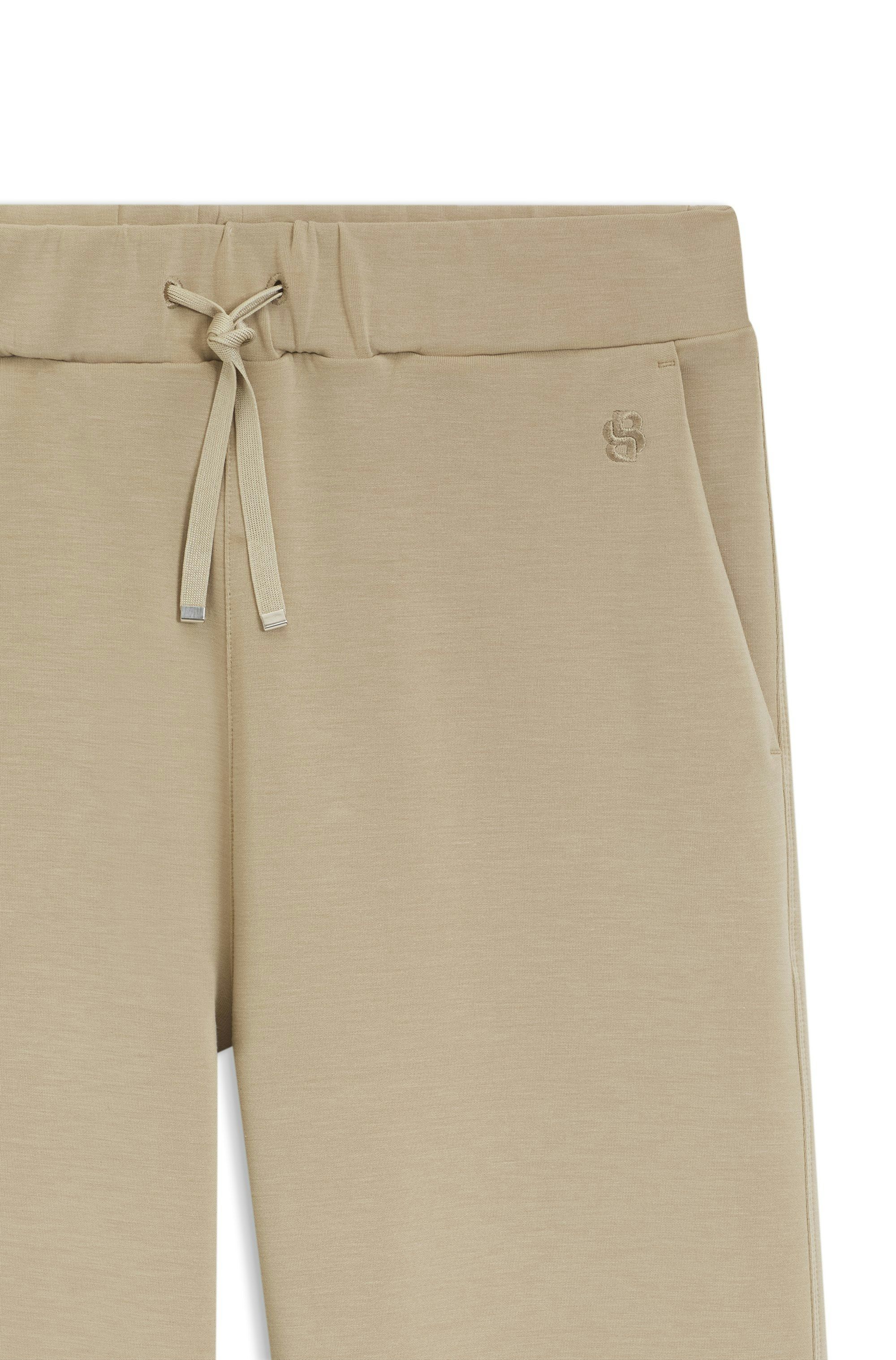Volné kalhoty z dvouvrstvého scuba žerzeje - Beige Overflow