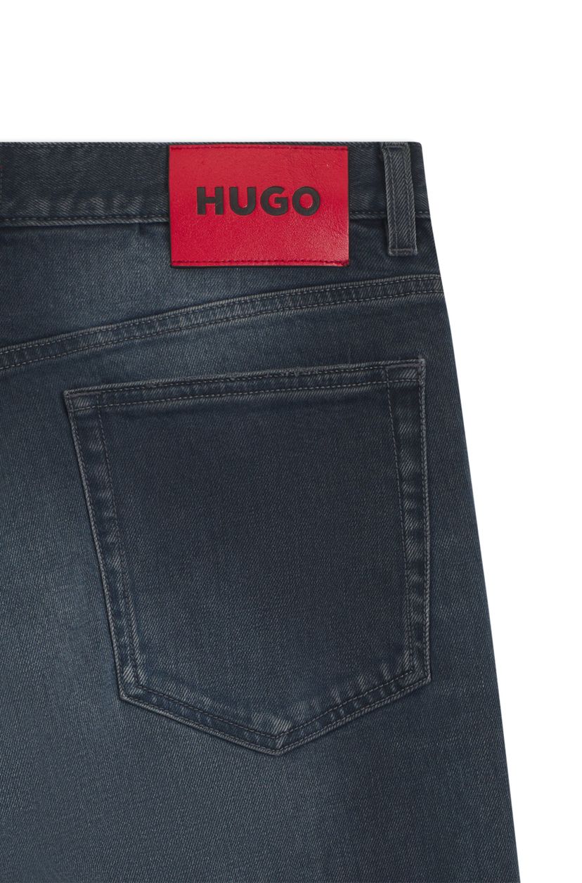 Slim džíny z modrého strečového denimu s „used“ efektem - galerie #1
